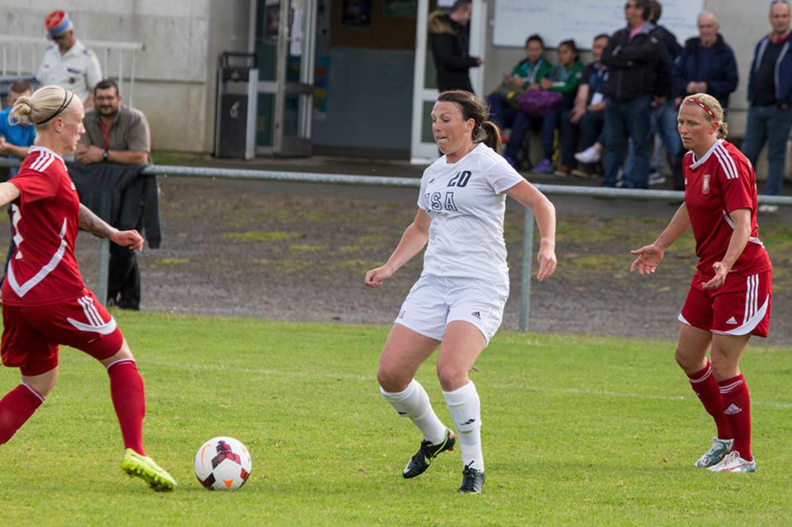 Marine Corps 1st Lt. Brittany Fruin of Camp Lejeune, NC passes the ball against Germany in their opening match of the 2016 Conseil International du Sport Militaire (CISM) World Women's Football Cup in Rennes, France 24 May to 6 June.  