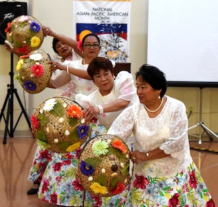 Dancers of the Filipino-American Association of Greater Columbia, SC,
perform a traditional Filipino dance during an Asian/Pacific American
Heritage Month celebration May 24, 2016 at Naval Health Clinic Charleston. (Navy photo/Hospitalman 3rd Class Robert Jackson)
