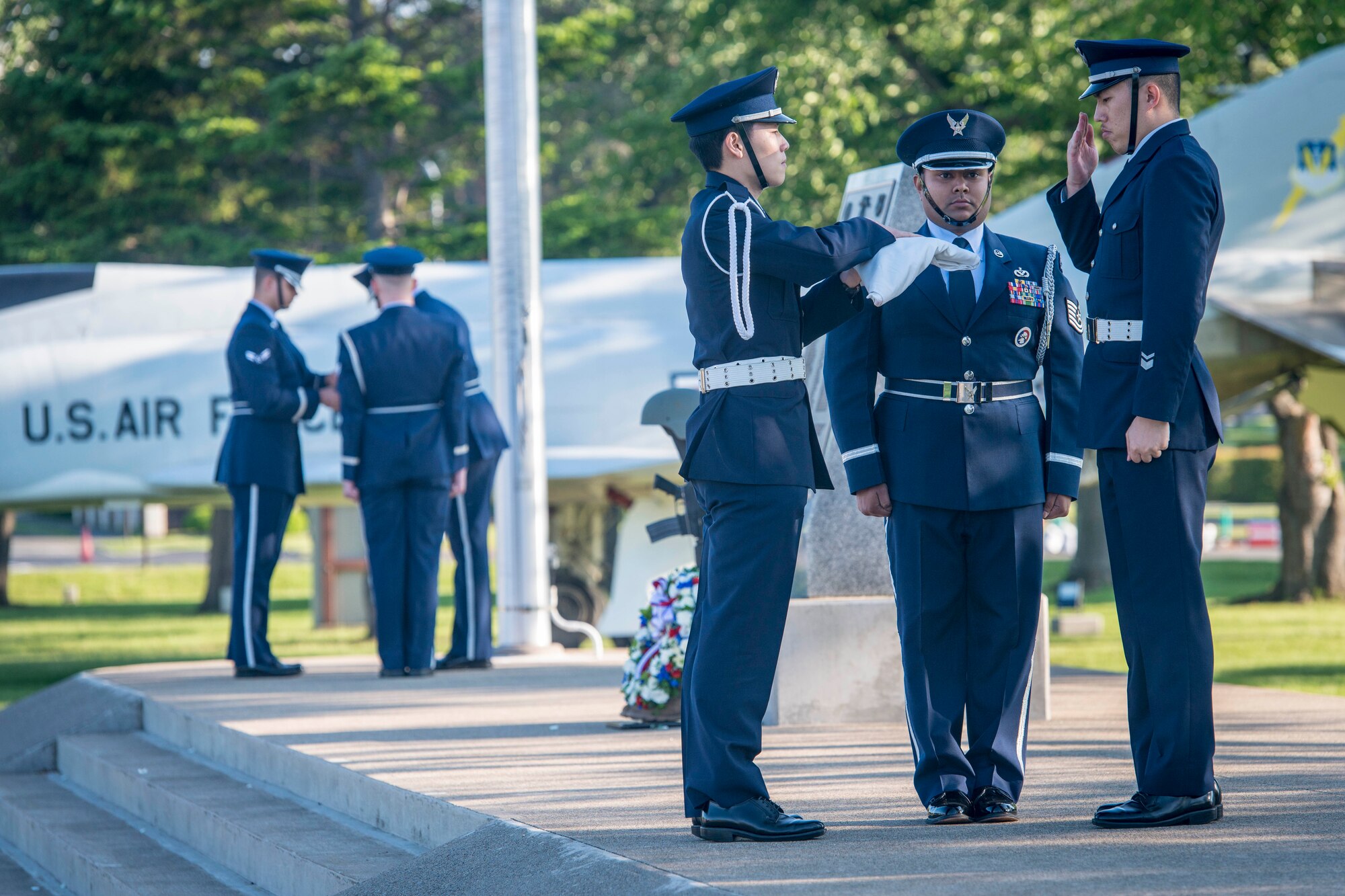 U.S. Air Force and Japan Air Self-Defense Force Airmen secure both the American and Japanese national flags during a Memorial Day retreat ceremony at Misawa Air Base, Japan, May 27, 2016. The bilateral honor guard, consisting of both American and Japanese Airmen, led the retreat ceremony by lowering, securing and saluting each flag. Memorial Day serves as an opportunity to pause and remember the sacrifices of more than one million Soldiers, Sailors, Airmen, Marines, and Coast Guardsmen who gave their lives to securing freedoms at home and across the globe. (U.S. Air Force photo by Staff Sgt. Benjamin W. Stratton)