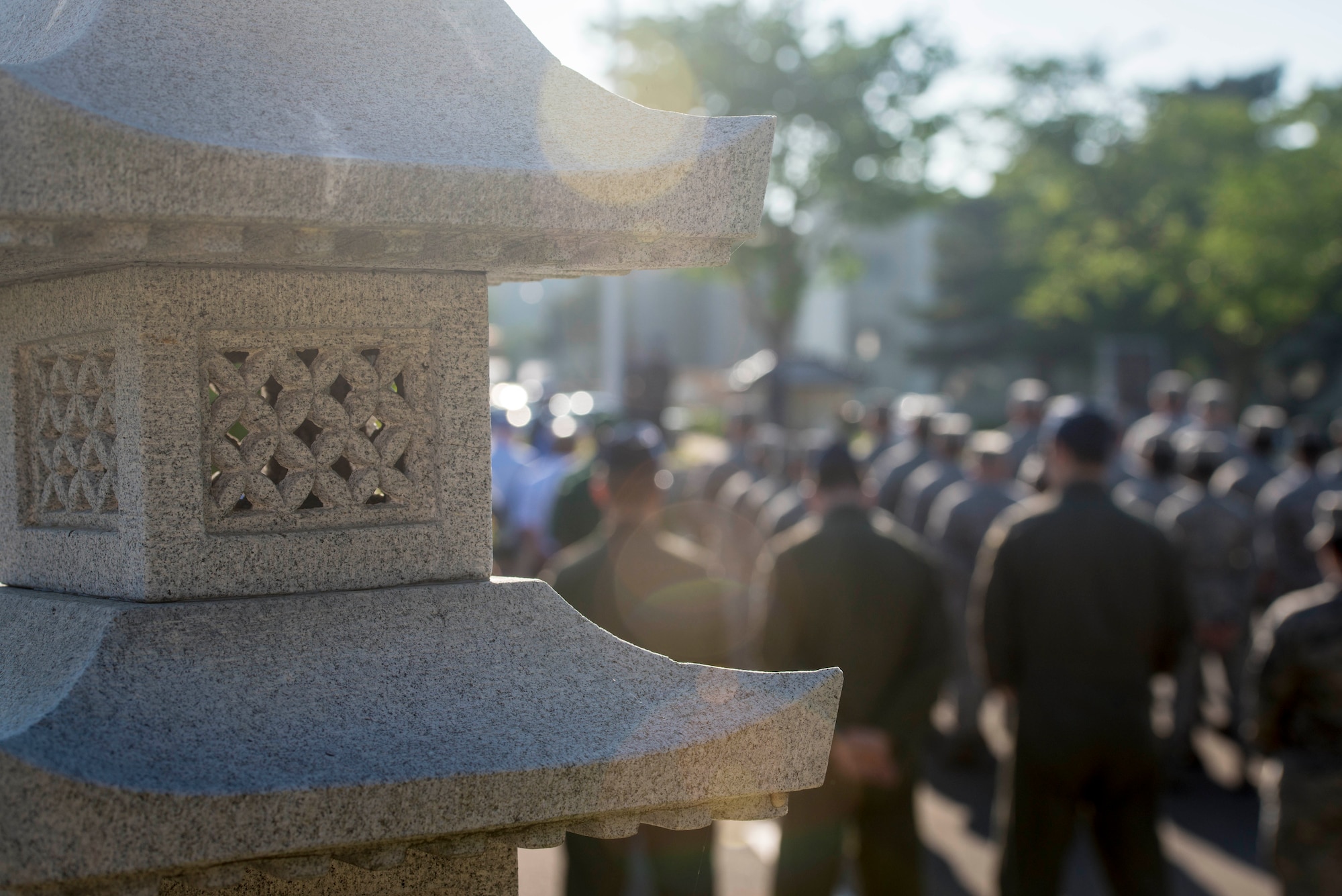 U.S. service members bow their heads during a moment of silence as part of a Memorial Day retreat ceremony at Misawa Air Base, Japan, May 27, 2016. Memorial Day serves as an opportunity to pause and remember the sacrifices of more than one million Soldiers, Sailors, Airmen, Marines, and Coast Guardsmen who gave their lives securing freedoms at home and across the globe. (U.S. Air Force photo by Staff Sgt. Benjamin W. Stratton)