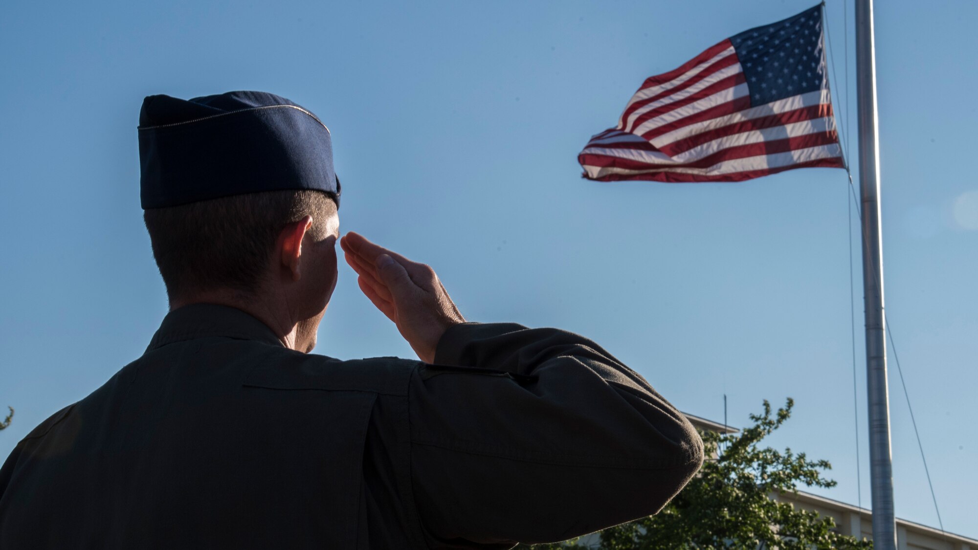 U.S. Air Force Lt. Col. Luke Casper, the commander of the 13th Fighter Squadron, salutes the U.S. flag during a Memorial Day retreat ceremony at Misawa Air Base, Japan, May 27, 2016. For more than 140 years, military members have gathered on Memorial Day to remember those who gave their lives for their country. (U.S. Air Force photo by Airman 1st Class Jordyn Fetter)