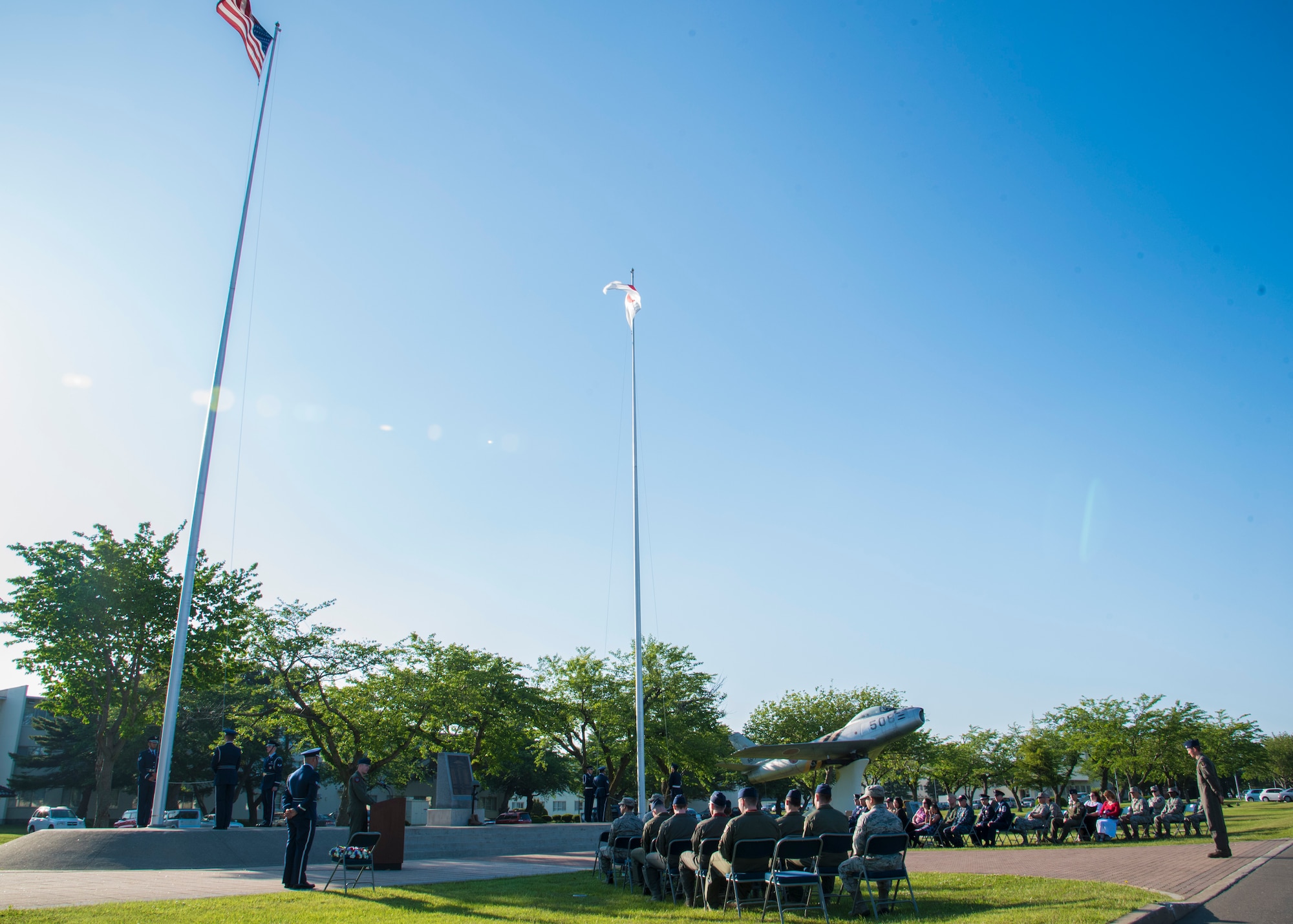 Japanese Air Self-Defense members, U.S. Air Force Airmen, Sailors and retirees, and their families gather for a Memorial Day retreat ceremony at Misawa Air Base, Japan, May 27, 2016. More than 200 past and present service members attended the observance to show respect to military members who gave the ultimate sacrifice in defense of their country. (U.S. Air Force photo by Airman 1st Class Jordyn Fetter)