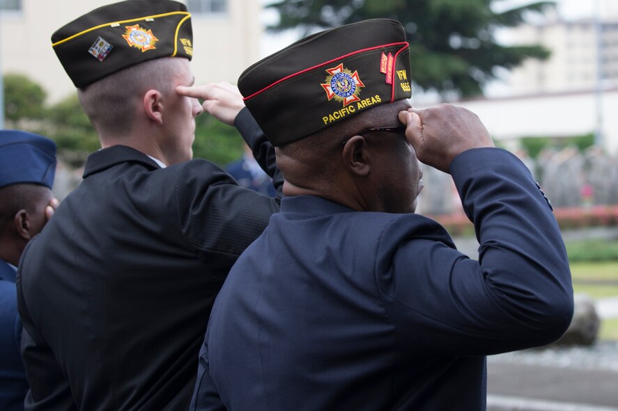 Members with the Veterans of Foreign War Past 9555 salute during the Memorial Day Ceremony at Yokota Air Base, Japan, May 27, 2016. The 374th Airlift Wing held the ceremony in memory of those who have given the ultimate sacrifice while in military service. (U.S. Air Force photo by Yasuo Osakabe/Released)