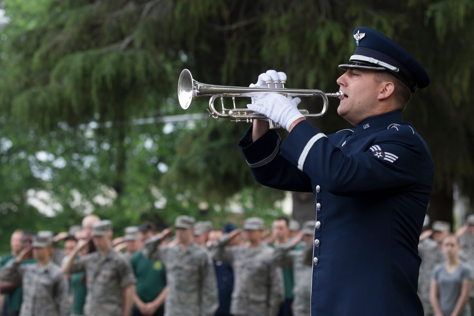 Senior Airman David Wuchter, U.S. Air Force Band of the Pacific-Asia, plays taps during the Memorial Day ceremony at Yokota Air Base, Japan, May 27, 2016. The 374th Airlift Wing held the ceremony in memory of those who have given the ultimate sacrifice while in military service. (U.S. Air Force photo by Yasuo Osakabe/Released)