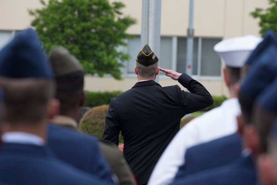 Tech. Sgt. Derick Nickless, member of the Veterans of Foreign War Post 9555, salutes during the Memorial Day Ceremony at Yokota Air Base, Japan, May 27, 2016. The 374th Airlift Wing held the ceremony in memory of those who have given the ultimate sacrifice while in military service. (U.S. Air Force photo by Yasuo Osakabe/Released)
