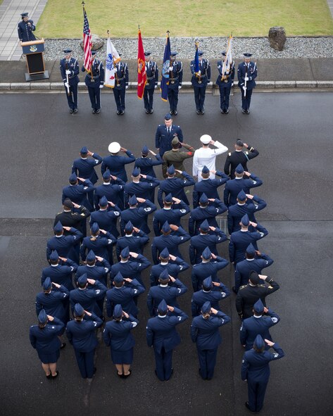 Military personnel render salutes during the Memorial Service Day Ceremony May 27, 2016 at Yokota Air Base, Japan. The 374th Airlift Wing hosted the ceremony in memory of those who made the ultimate sacrifice during military service.  (U.S. Air Force photo by Yasuo Osakabe/Released)