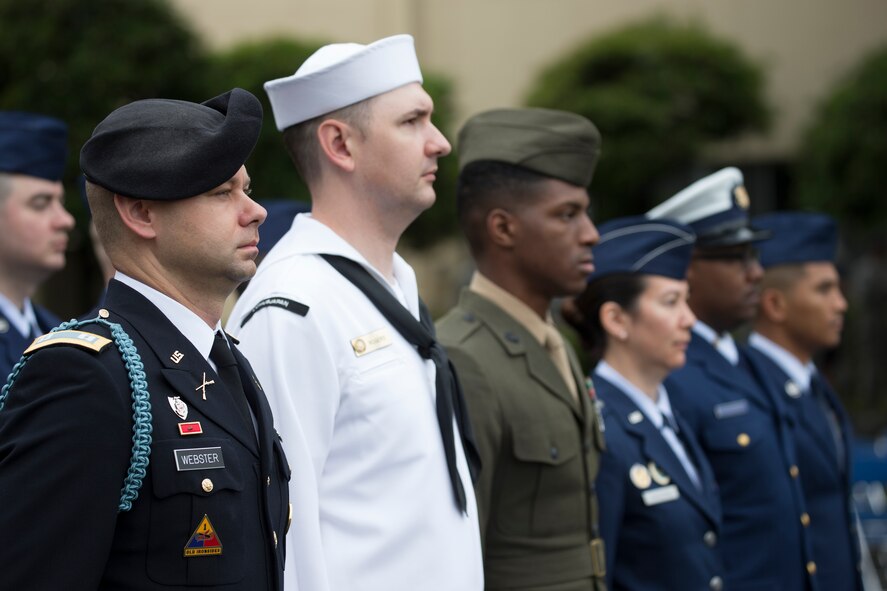 Military personnel stand in formation during the Memorial Day Ceremony May 27, 2016 at Yokota Air Base, Japan. The 374th Airlift Wing hosted the ceremony in memory of those who made the ultimate sacrifice during military service. (U.S. Air Force photo by Yasuo Osakabe/Released)
