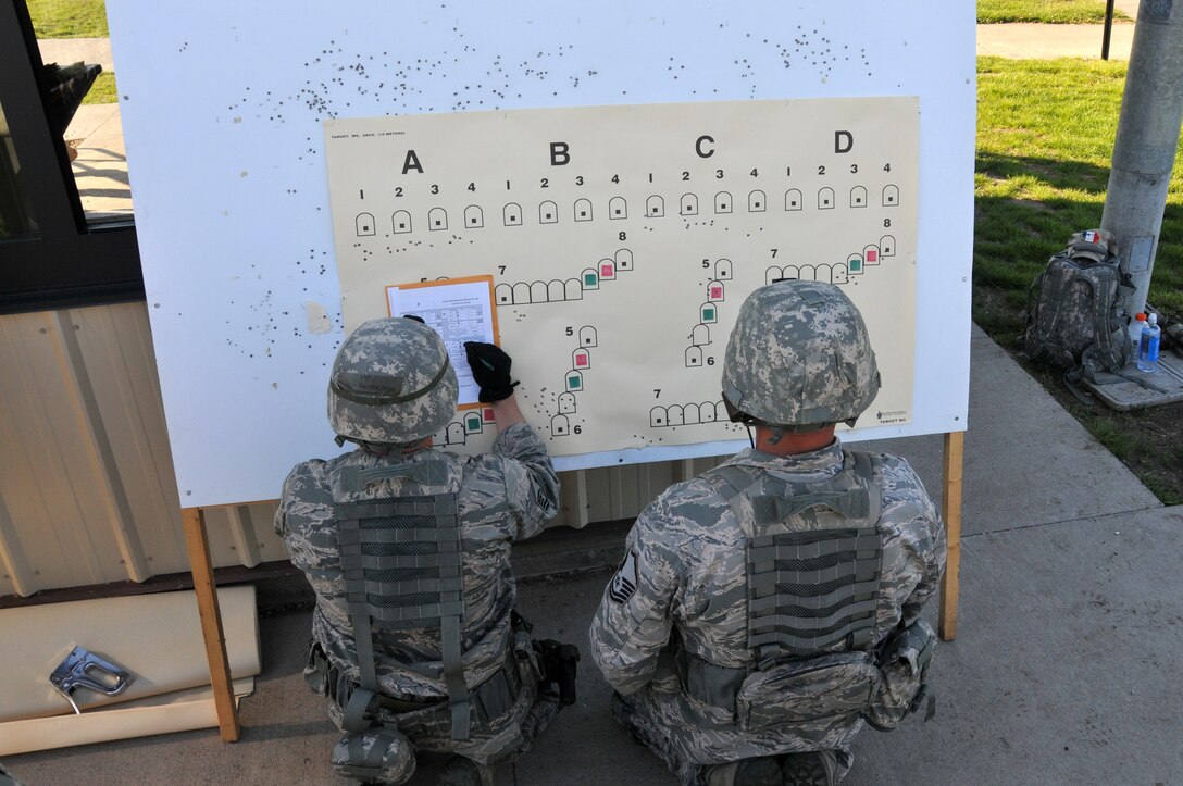 Members from the 185th Air Refueling Wing count bullet holes during the Governor’s X shooting competition at Camp Dodge, Iowa, May 22 2016. Teams from the 185th ARW took first and second place in the total combined score of the event. (U.S. Air National Guard Photo by Capt. Jeremy McClure/released) 