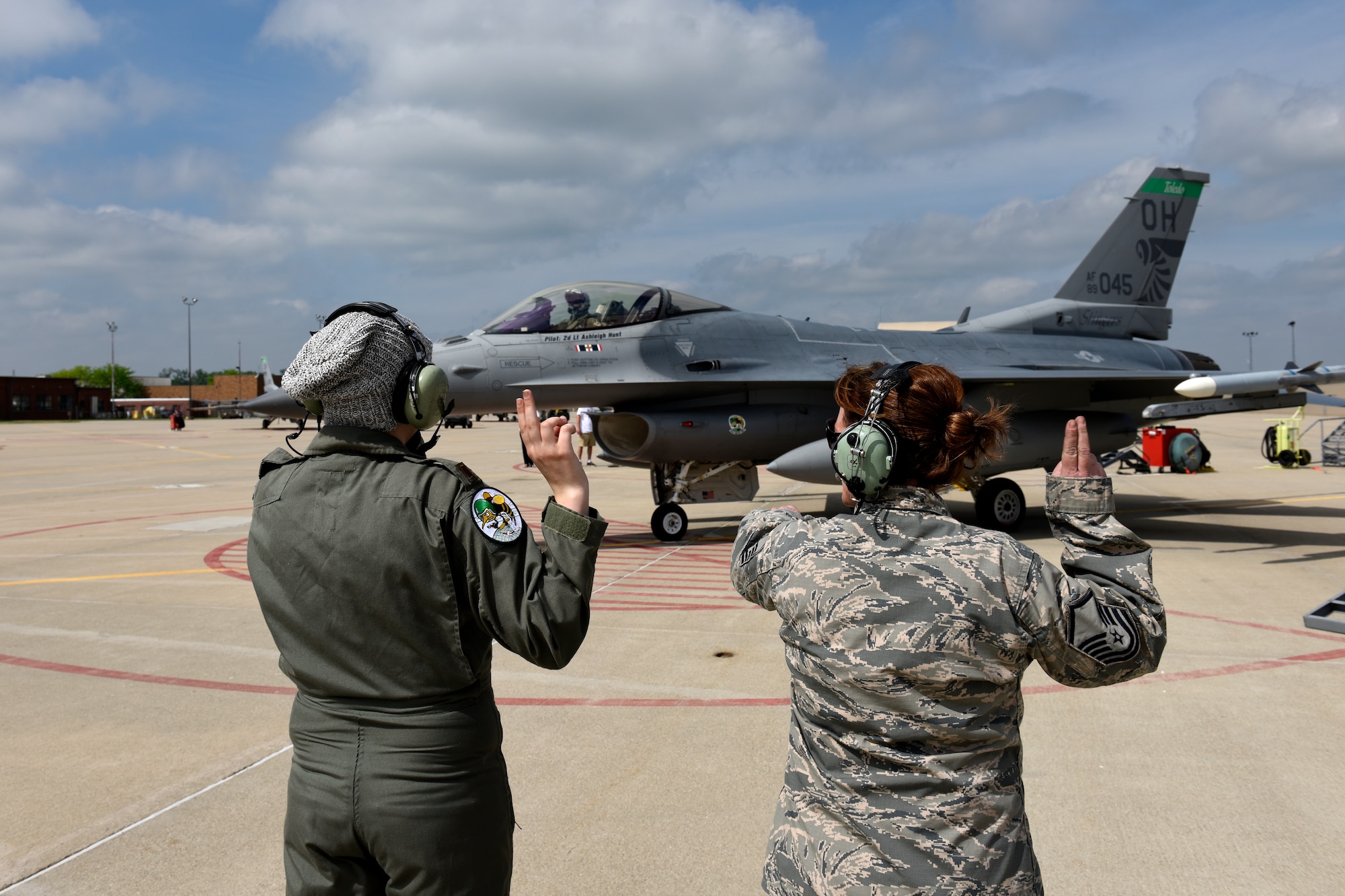 Honorary 2nd Lt. Ashleigh Hunt and U.S. Air Force Master Sgt. Kathryn L. Dorhmann, a crew chief assigned to the 180th Fighter Wing, launch an F-16 Fighting Falcon May 26, 2016 during Pilot for a Day, a program supporting children and young adults who live with chronic or life-threatening illnesses. The Pilot for a Day program allows the 180FW to give back to the local community, whose enduring support for the Airmen makes the 180FW mission possible. (U.S. Air National Guard photo by Staff Sgt. Shane Hughes)