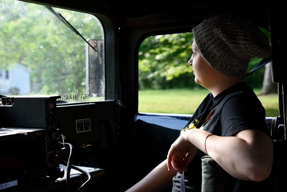 The U.S. Army Reserve 983rd Engineer Battalion escorted Ashleigh Hunt, a 22 year-old Ohio resident diagnosed with osteosarcoma, in a humvee to the 180th Fighter Wing in Swanton, Ohio where she was designated a pilot for a day May 26, 2016. During the Pilot for a Day event, Hunt was commissioned as an honorary 2nd Lt., launched an F-16 Fighting Falcon, received a tour of the base facilities, and experienced basic pilot survival and parachute training. (U.S. Air National Guard photo by Staff Sgt. Shane Hughes)