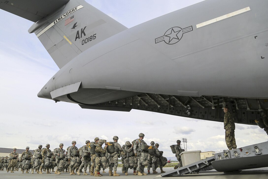 Paratroopers board an Air Force C-17 Globemaster III aircraft before participating in air transportability training at Joint Base Elmendorf-Richardson, Alaska, May 19, 2016. The aircraft crew is assigned to the 517th Airlift Squadron. Air Force photo by Alejandro Pena