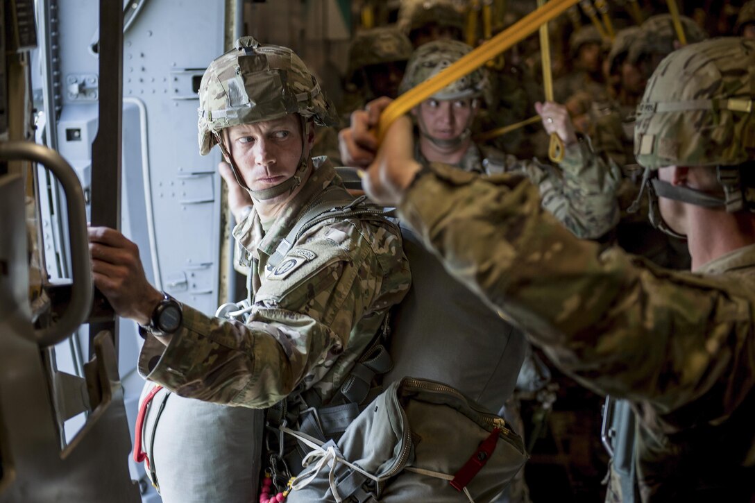 A soldier waits for the signal to jump during a static line air-drop from a C-17 Globemaster III over Fort Bragg, N.C., May 26, 2016. Air Force photo by Tech. Sgt. Jason Robertson