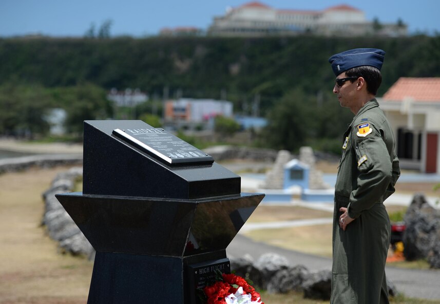 First Lt. Stephen Dupuis, 69th Expeditionary Bomb Squadron electronic warfare officer, reads the names off of the RAIDR 21 monument May 28, 2016, in Adelup, Guam. The monument honors six B-52 Stratofortress aviators who lost their lives July 21, 2008, during a training mission. (U.S. Air Force photo by Staff Sgt. Benjamin Gonsier)