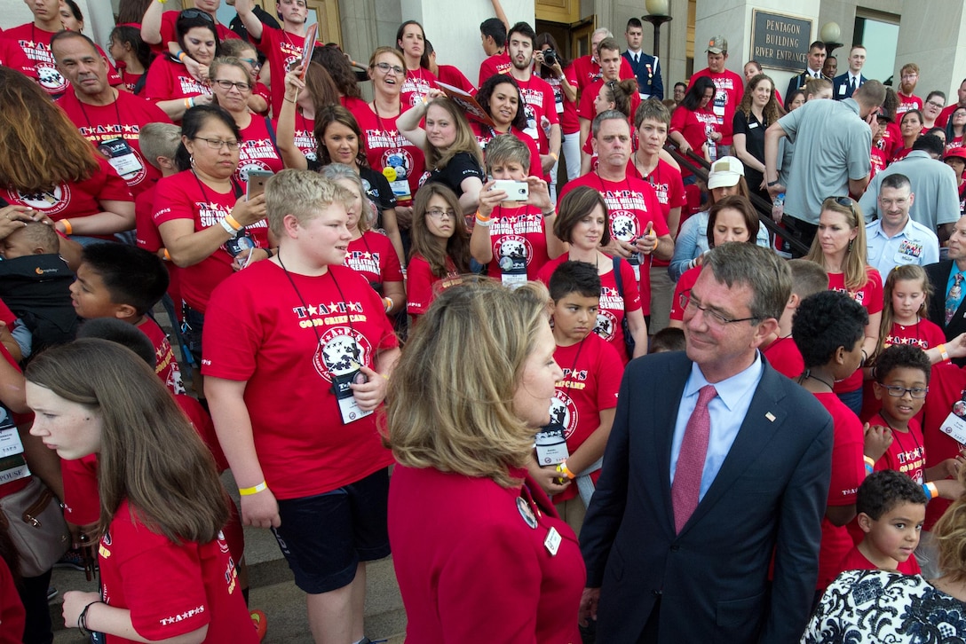 Defense Secretary Ash Carter speaks with Bonnie Carroll, president of the Tragedy Assistance Program for Survivors, or TAPS, while welcoming more than 350 TAPS members to the Pentagon, May 27, 2016, for a night of fun and remembrance to coincide with Memorial Day weekend. TAPS offers support to people who have lost a family member serving in the military. DoD photo by EJ Hersom