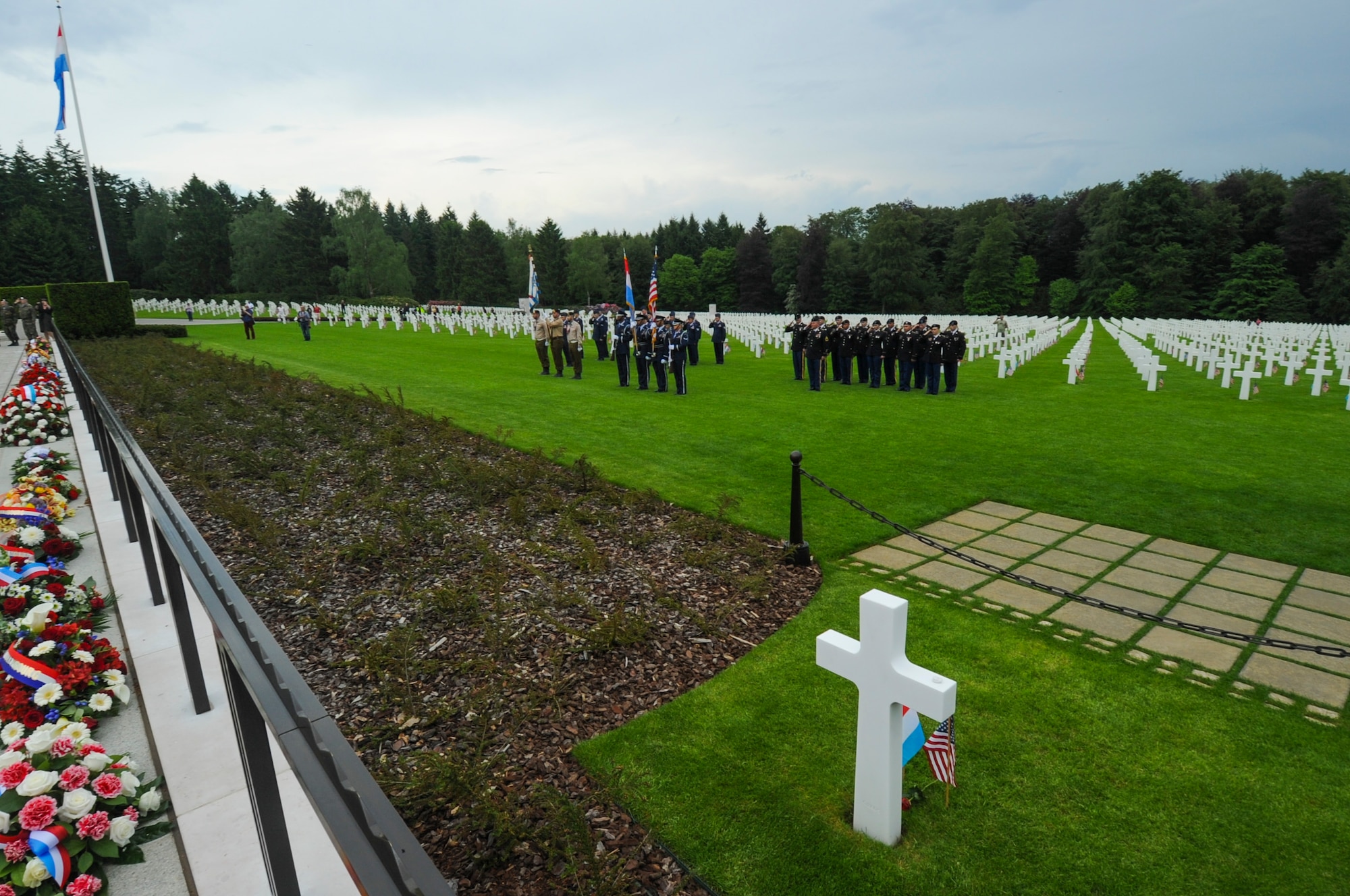 Luxembourg Army Color Guard, U.S. Air Force Airmen assigned to the 52nd Fighter Wing, Spangdahlem Air Base, Germany, and U.S. Army Soldiers assigned to 18th Military Police Brigade, Grafenwoehr, Germany, salute during a Memorial Day ceremony at the Luxembourg American Cemetery and Memorial in Luxembourg, May 28, 2016. The holiday serves as an opportunity to pause and remember the sacrifices of more than one million Soldiers, Sailors, Airmen, Marines and Coast Guardsmen who gave their lives in defense of freedom.   (U.S. Air Force photo by Staff Sgt. Joe W. McFadden/Released)  
