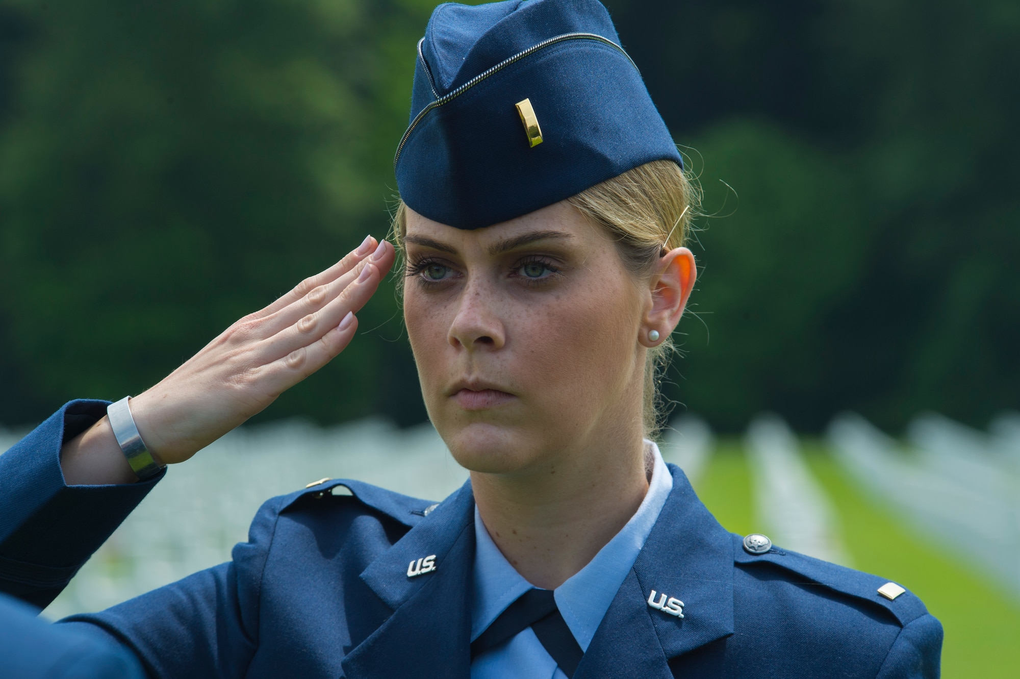 U.S. Air Force 2nd Lt. Melanie Gruenbaum, 52nd Mission Support Group executive officer, salutes as part of a ceremonial flight before a Memorial Day ceremony at the Luxembourg American Cemetery and Memorial in Luxembourg, May 28, 2016. Airmen from Spangdahlem Air Base, Germany, served as a ceremonial flight in service dress, caretakers of the cemetery's Luxembourg and U.S. flags, and escorts for guests to lay wreaths. (U.S. Air Force photo by Staff Sgt. Joe W. McFadden/Released)  