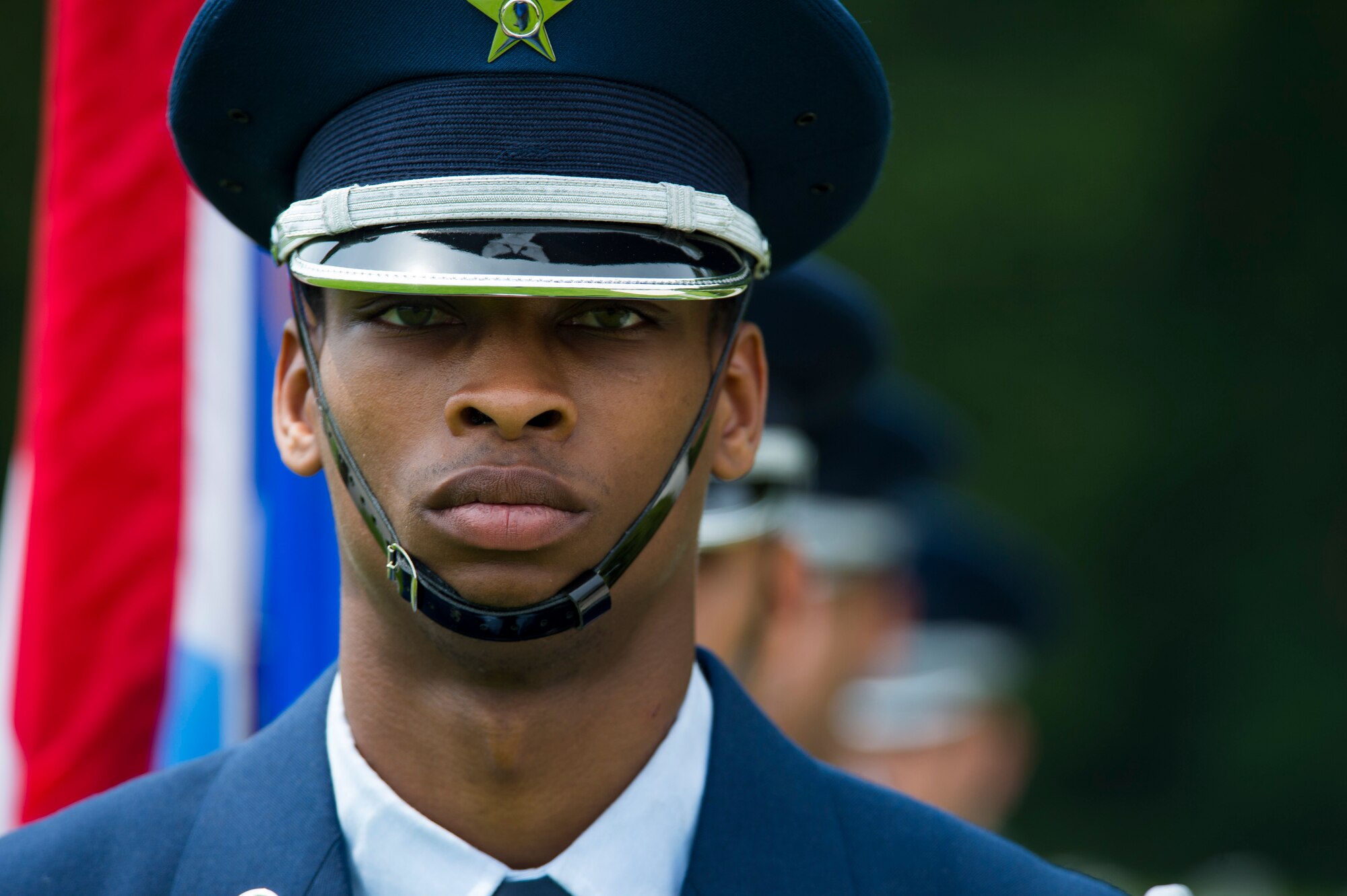 U.S. Air Force Airman 1st Class Jeffery Stewart, a Spangdahlem Air Base Ceremonial Guardsman, stands at parade rest before his detail presents the colors as part of a Memorial Day ceremony at the Luxembourg American Cemetery and Memorial in Luxembourg, May 28, 2016. Airmen from Spangdahlem Air Base, Germany, served as a ceremonial flight in service dress, caretakers of the cemetery's Luxembourg and U.S. flags, and escorts for guests to lay wreaths. (U.S. Air Force photo by Staff Sgt. Joe W. McFadden/Released)  