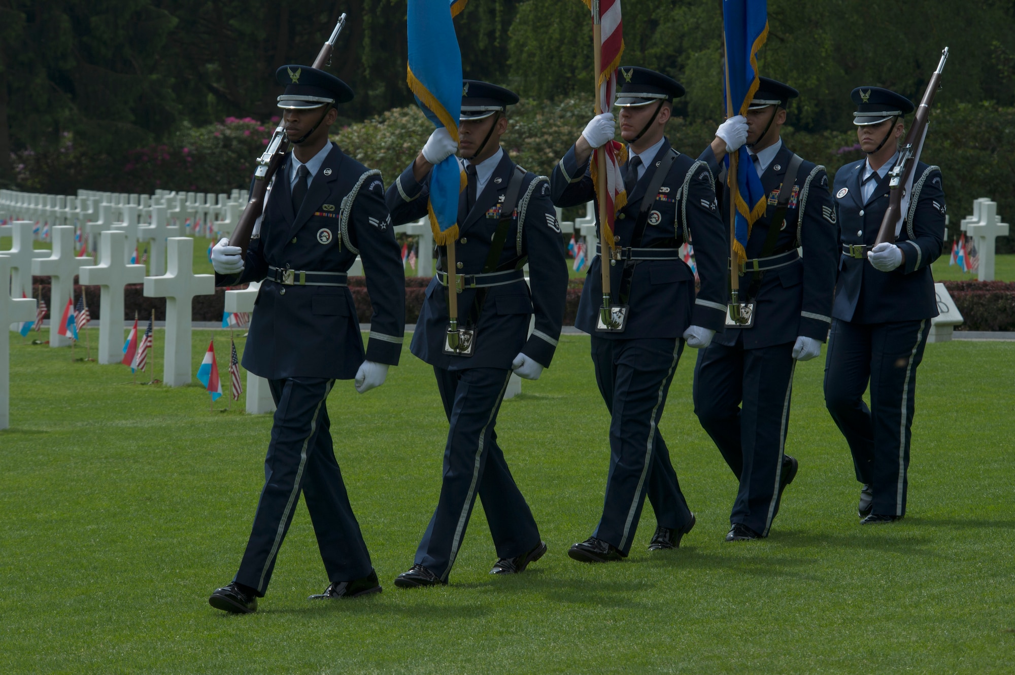 U.S. Air Force ceremonial guardsmen from Spangdahlem Air Base, Germany, carry the colors at the beginning of a Memorial Day ceremony at the Luxembourg American Cemetery and Memorial in Luxembourg, May 28, 2016. Memorial Day is observed on the last Monday of May in remembrance of those who gave the ultimate sacrifice. (U.S. Air Force photo by Staff Sgt. Joe W. McFadden/Released)  