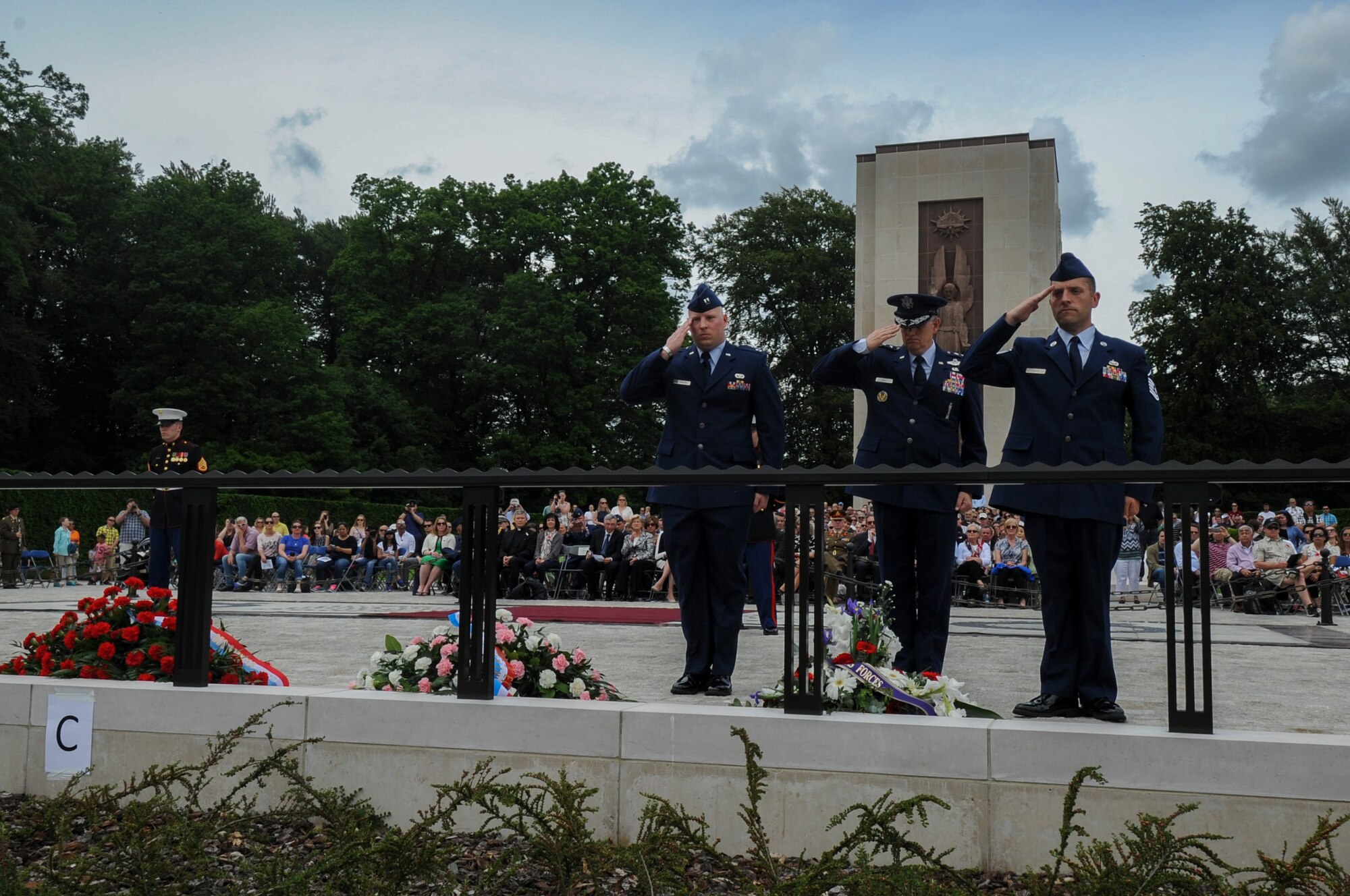 U.S. Air Force Lt. Gen. Timothy Ray, 3rd Air Force and 17th Expeditionary Air Force commander, center, salutes a wreath during a Memorial Day ceremony at the Luxembourg American Cemetery and Memorial in Luxembourg, May 28, 2016. More than 200 Luxembourgers and Americans gathered at the cemetery to reflect on the sacrifices made by fallen U.S. service members. (U.S. Air Force photo by Staff Sgt. Joe W. McFadden/Released)  