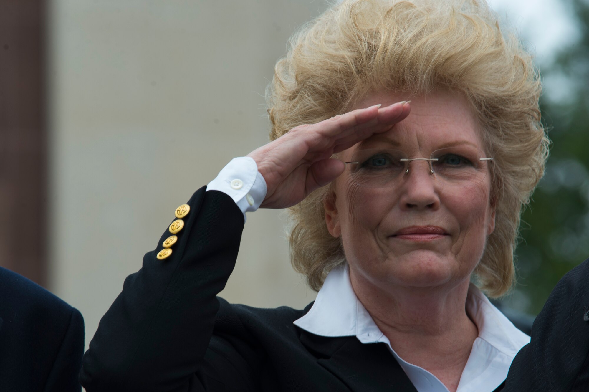 Marilynn Rustand Lieurance, daughter of U.S. Army Air Corps 1st Lt. Hanford "Rusty" J. Rustand, a B-17 bomber pilot killed in World War II, salutes after laying a wreath during a Memorial Day ceremony at the Luxembourg American Cemetery and Memorial in Luxembourg, May 28, 2016. Rustand died when his B-17 came under enemy fire during a mission near Merseburg, Germany, and crashed on Nov. 2, 1944, nearly half a year before Lieurance was born. (U.S. Air Force photo by Staff Sgt. Joe W. McFadden/Released)