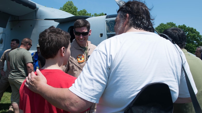 Capt. Ben Price, the current operations officer with Marine Medium Tiltrotor Squadron 261, speaks with New Yorkers about the MV-22 Osprey during Military Day as part of Fleet Week at Eisenhower Park in East Meadow, New York, May 28, 2016. The Marines and sailors are visiting to interact with the public, demonstrate capabilities and teach the people of New York about America’s sea services.