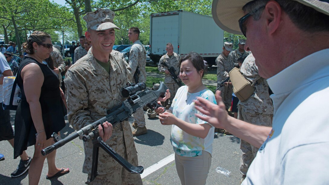 Lance Cpl. Kurt Spinney, a rifleman with 3rd Battalion, 6th Marine Regiment, teaches New Yorkers about the M249B machine gun during Military Day as part of Fleet Week at Eisenhower Park in East Meadow, New York, May 28, 2016. The Marines and sailors are visiting to interact with the public, demonstrate capabilities and teach the people of New York about America’s sea services.