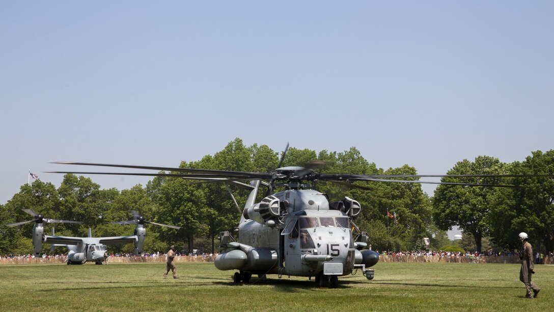 A U.S. Marine Corps CH-53E Super Stallion and MV-22 Osprey are staged for a static display during Military Day as part of Fleet Week at Eisenhower Park, in East Meadow, New York, May 28, 2016. U.S. Marines and sailors are visiting to interact with the public, demonstrate capabilities and teach the people of New York about America's sea services. (U.S. Marine Corps photo by 24th MEU Combat Camera Lance Cpl. Hernan Vidana/Released)