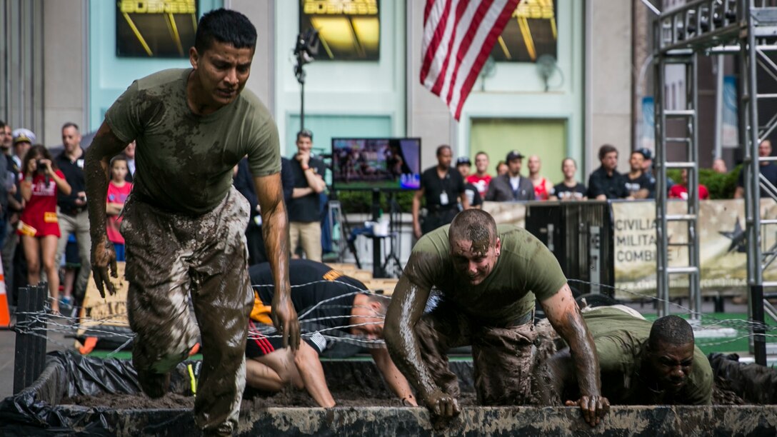 Marines with the 24th Marine Expeditionary Unit compete in an obstacle course during the Fox and Friends Weekend news program, May 28, 2016. U.S. Marines and sailors are in New York for Fleet Week to interact with the public, demonstrate capabilities and teach the people of New York about America's sea services.
