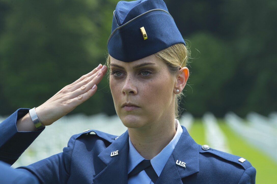 Air Force 2nd Lt. Melanie Gruenbaum salutes while serving as part of a ceremonial flight for a Memorial Day ceremony at the Luxembourg American Cemetery and Memorial in Luxembourg, May 28, 2016. Gruenbaum is executive officer of the 52nd Mission Support Group, based at Spangdahlem Air Base, Germany. Air Force photo by Staff Sgt. Joe W. McFadden