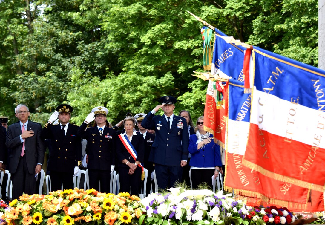 PARIS – As taps plays, U.S. and French officials, including U.S. Air Force Gen. Frank Gorenc, U.S. Air Forces in Europe-Air Forces Africa commander, render honors following a Memorial Day ceremony at the Lafayette Escadrille Memorial, in Marnes-la-Coquette, France, May 28, 2016. During the ceremony, French and American speakers honored the shared sacrifices of U.S. and French service members fighting for each other’s freedom and security in a relationship that began more than 240 years ago during the American Revolutionary War. (U.S. Air Force photo by Senior Master Sgt. Brian Bahret/Released) 