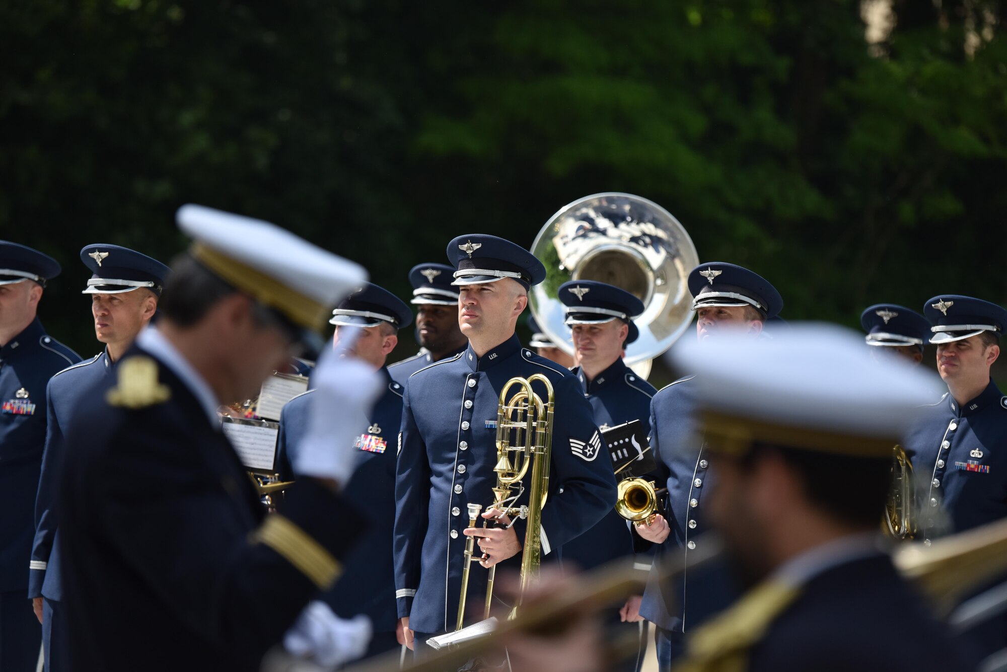 PARIS – Airmen from the U.S. Air Forces in Europe Band stand at attention as a French military band plays ceremonial music during a Memorial Day ceremony at the Lafayette Escadrille Memorial, in Marnes-la-Coquette, France, May 28, 2016. During the ceremony, French and American speakers honored the shared sacrifices of U.S. and French service members fighting for each other’s freedom and security in a relationship that began more than 240 years ago during the American Revolutionary War. (U.S. Air Force photo by Senior Master Sgt. Brian Bahret/Released)