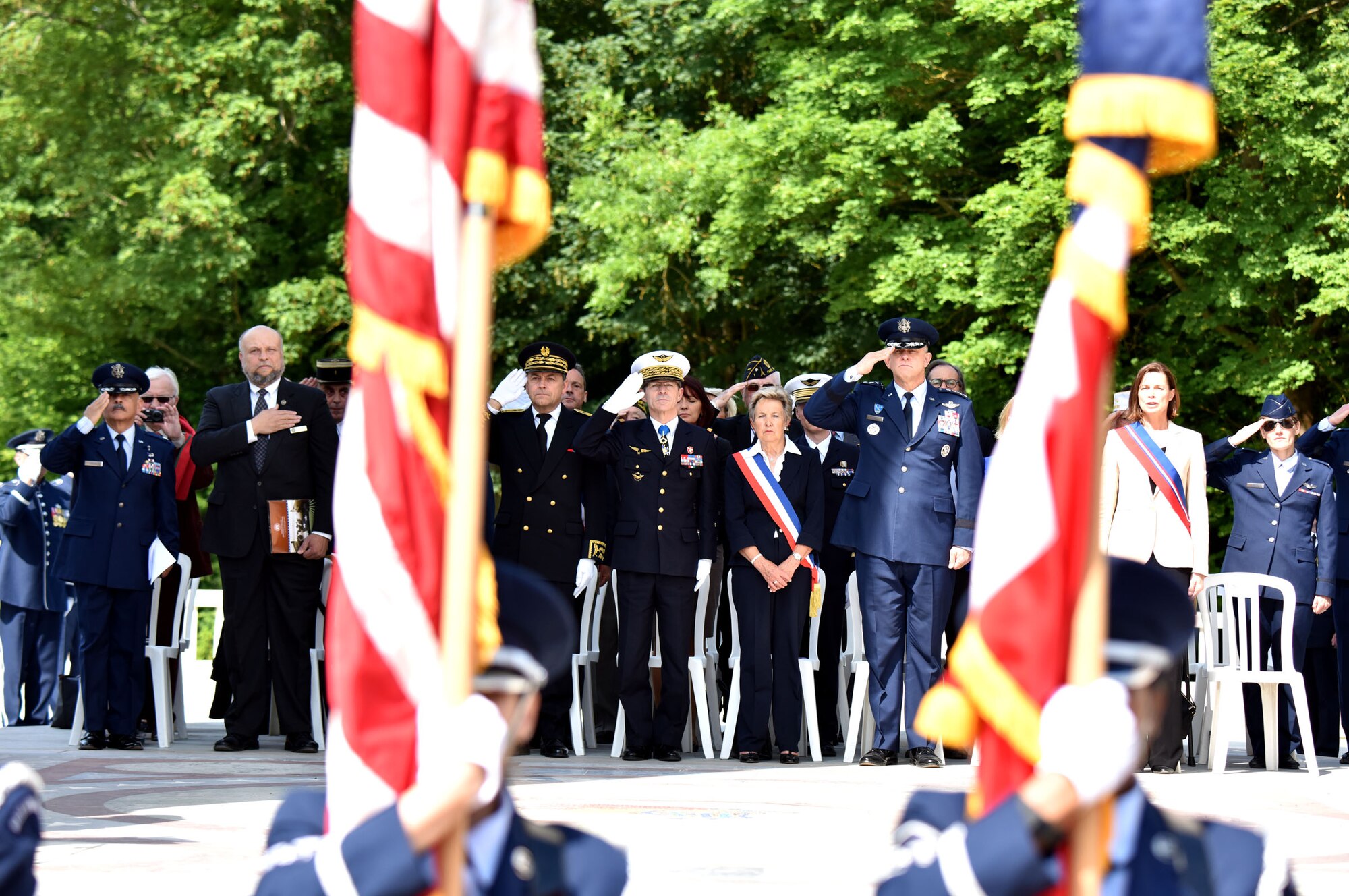 PARIS – U.S. Air Force Gen. Frank Gorenc, U.S. Air Forces in Europe-Air Forces Africa commander, Christiane Barody-Weiss, Mayor of Marnes-la-Coquette, France, French Gen. Bernard Schuler, French Strategic Air Forces Command commander, and Mr Yann Jounot, Prefect of the Hauts-de-Seine, render honors during the American National Anthem in a Memorial Day ceremony at the Lafayette Escadrille Memorial, in Marnes-la-Coquette, France, May 28, 2016.  Each offered a speech commemorating the shared sacrifices of French and American force, and recognizing the enduring relationship the two countries have maintained for more than 240 years.(U.S. Air Force photo by Senior Master Sgt. Brian Bahret/Released) 