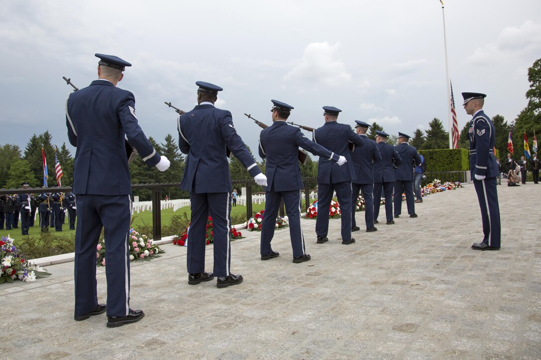 Airmen participate in a ceremony honoring fallen service members at the Luxembourg American Cemetery and Memorial in Luxembourg, May 28, 2016. Hundreds gathered to pay respects at the cemetery, which serves as the final resting place for more than 5,000 service members. Army photo by Spc. Tracy McKithern