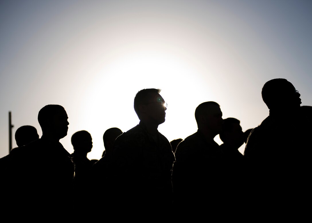 Airmen from the 455th Expeditionary Civil Engineer Squadron stand in formation before the commencement of a flag retirement ceremony at Bagram Airfield, Afghanistan, May 28, 2016. When the U.S. flag becomes worn, torn, or soiled, a flag retirement ceremony is conducted to replace the old flag with a new flag. (U.S. Air Force photo by Senior Airman Justyn M. Freeman)
