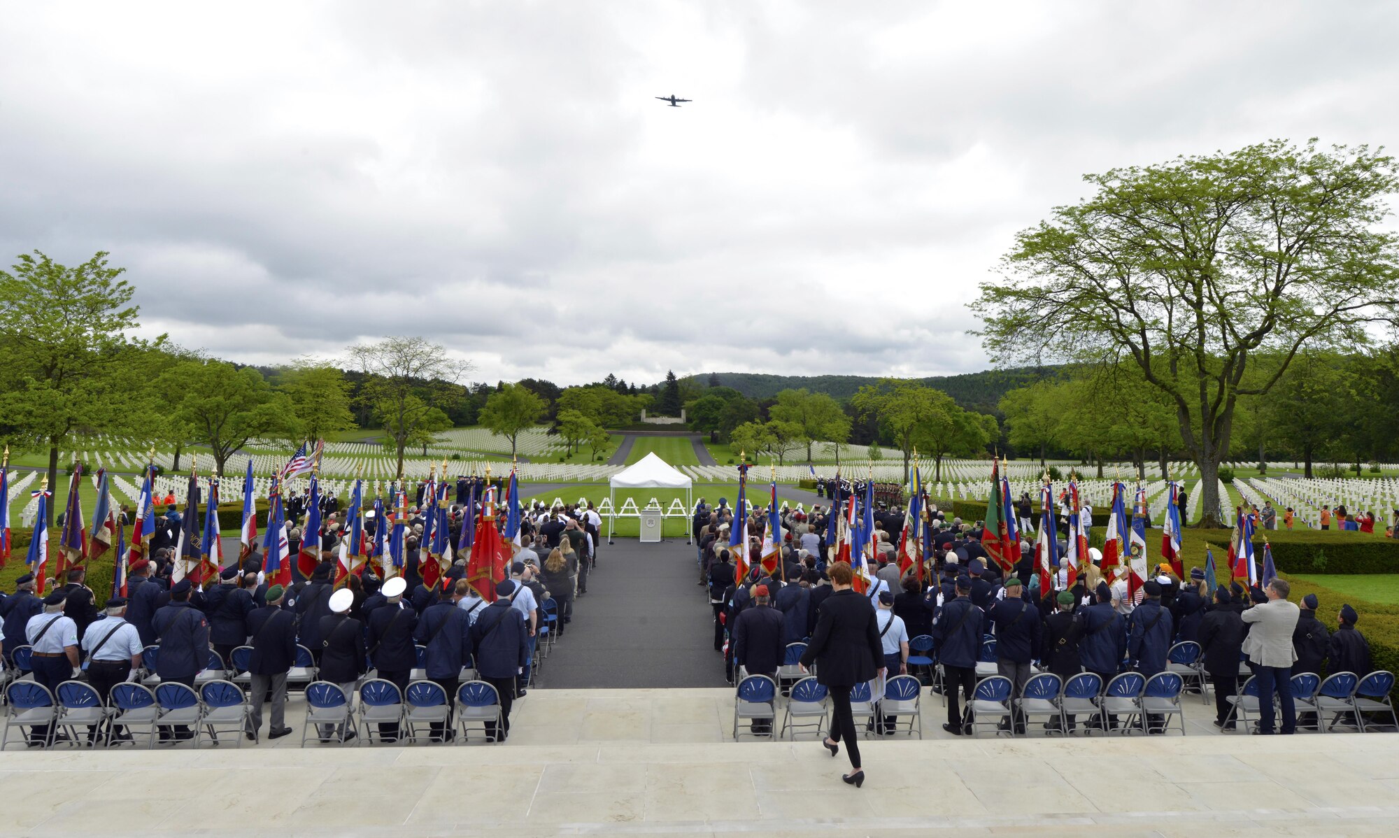 A 37th Airlift Squadron C-130J Super Hercules flies over a Memorial Day ceremony May 29, 2016, at Lorraine American Cemetery and Memorial, in St. Avold, France. The flyover renders honors to those buried in the cemetery. (U.S. Air Force photo/Staff Sgt. Sharida Jackson)