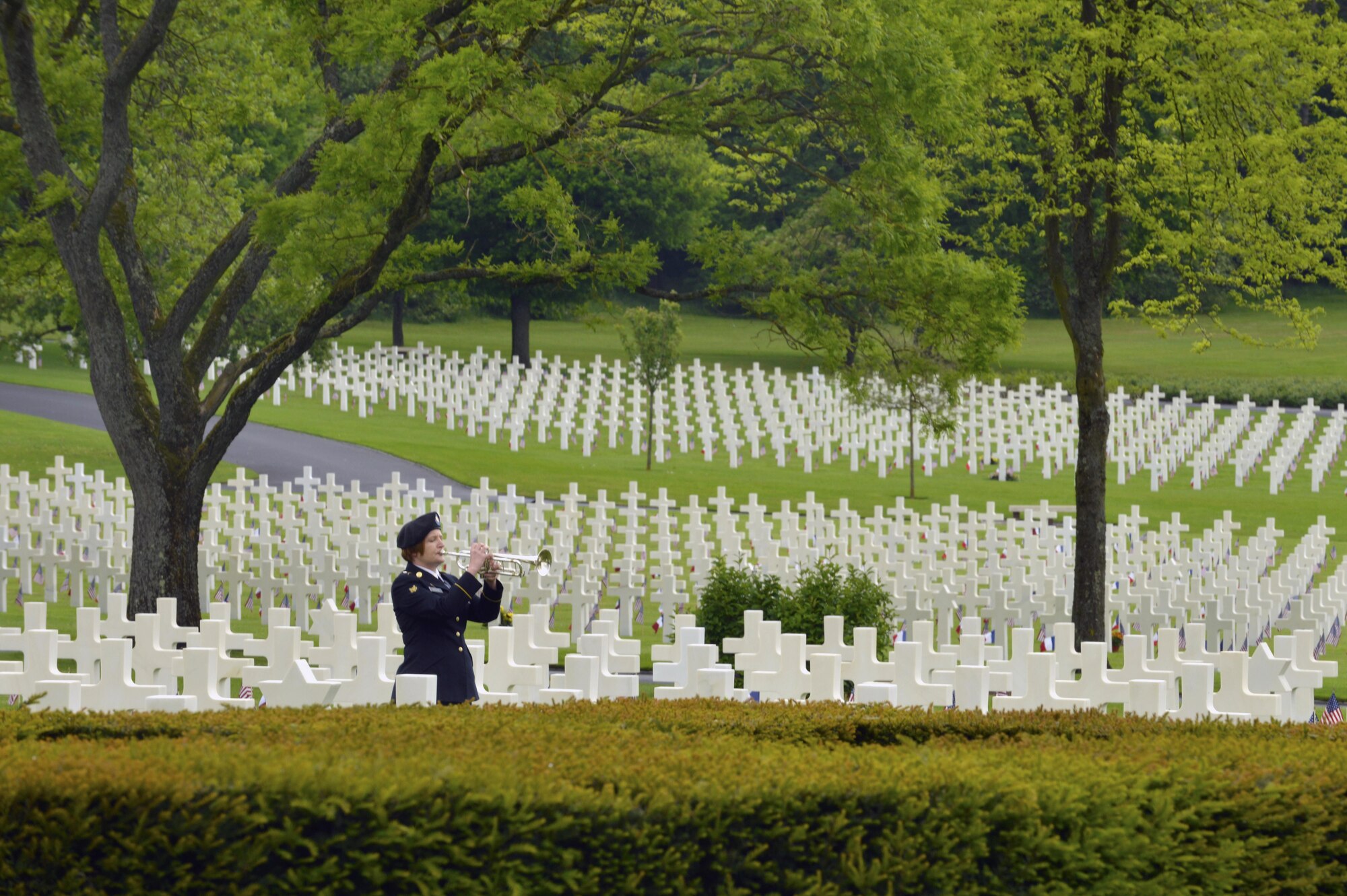 A bugler from the 16th Sustainment Brigade plays Taps during a Memorial Day ceremony May 29, 2016, at Lorraine American Cemetery and Memorial, in St. Avold, France. The cermony honored the sacrifices of fallen American servicemembers. (U.S. Air Force photo/Staff Sgt. Sharida Jackson)
