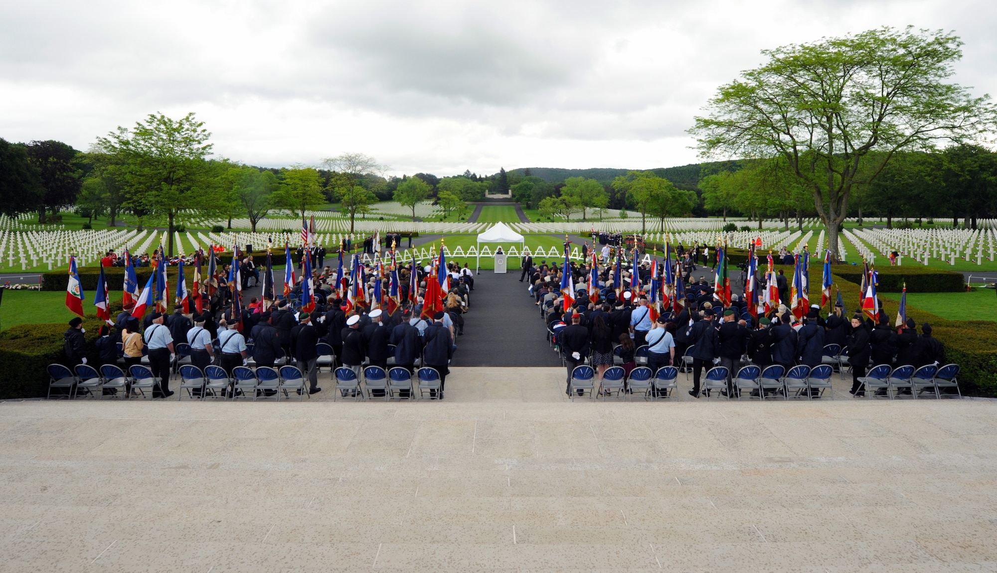 Attendees await the arrival of the official party May 29, 2016 at Lorraine American Cemetery and Memorial, in St. Avold, France. More than 1,500 people attended the Memorial Day ceremony honoring fallen American servicemembers. (U.S. Air Force photo/Staff Sgt. Sharida Jackson)