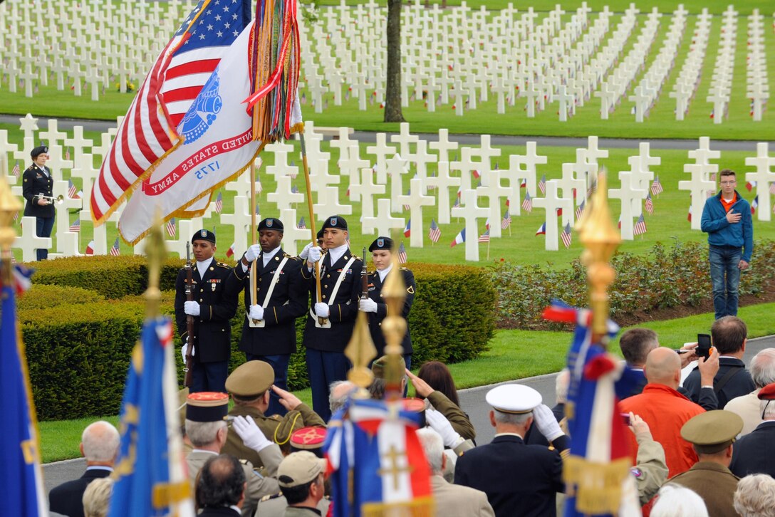 Soldiers assigned to the 16th Sustainment Brigade present the colors during a Memorial Day ceremony at Lorraine American Cemetery in Saint-Avold, France, May 29, 2016. The cemetery is the final resting place for more than 10,000 Americans who gave their lives in World War II. Air Force photo by Staff Sgt. Sharida Jackson