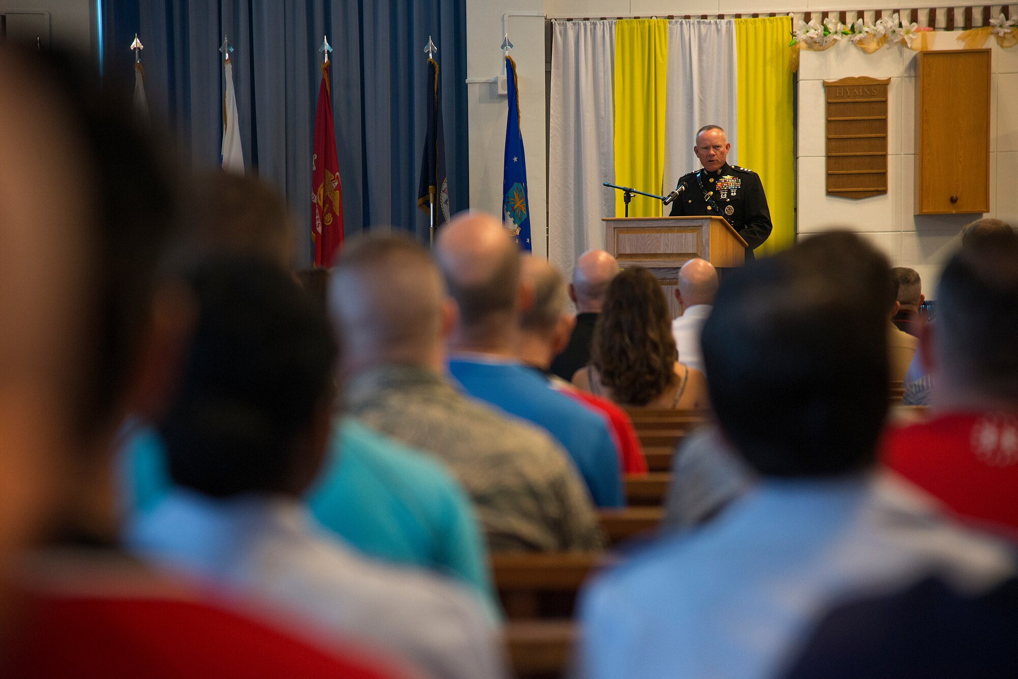 U.S. Marine Corps Lt. Gen. Lawrence Nicholson, III Marine Expeditionary Force commanding general and commander of Marine Forces Japan, gives a speech during the Memorial Day ceremony held at Chapel 1 May 30, 2016, at Kadena Air Base, Japan. During his speech, Nicholson reminded the audience that the holiday should be seen as more than just a long weekend and charged them with ensuring larger attendance in the years to come. (U.S. Air Force photo by Staff Sgt. Maeson L. Elleman)