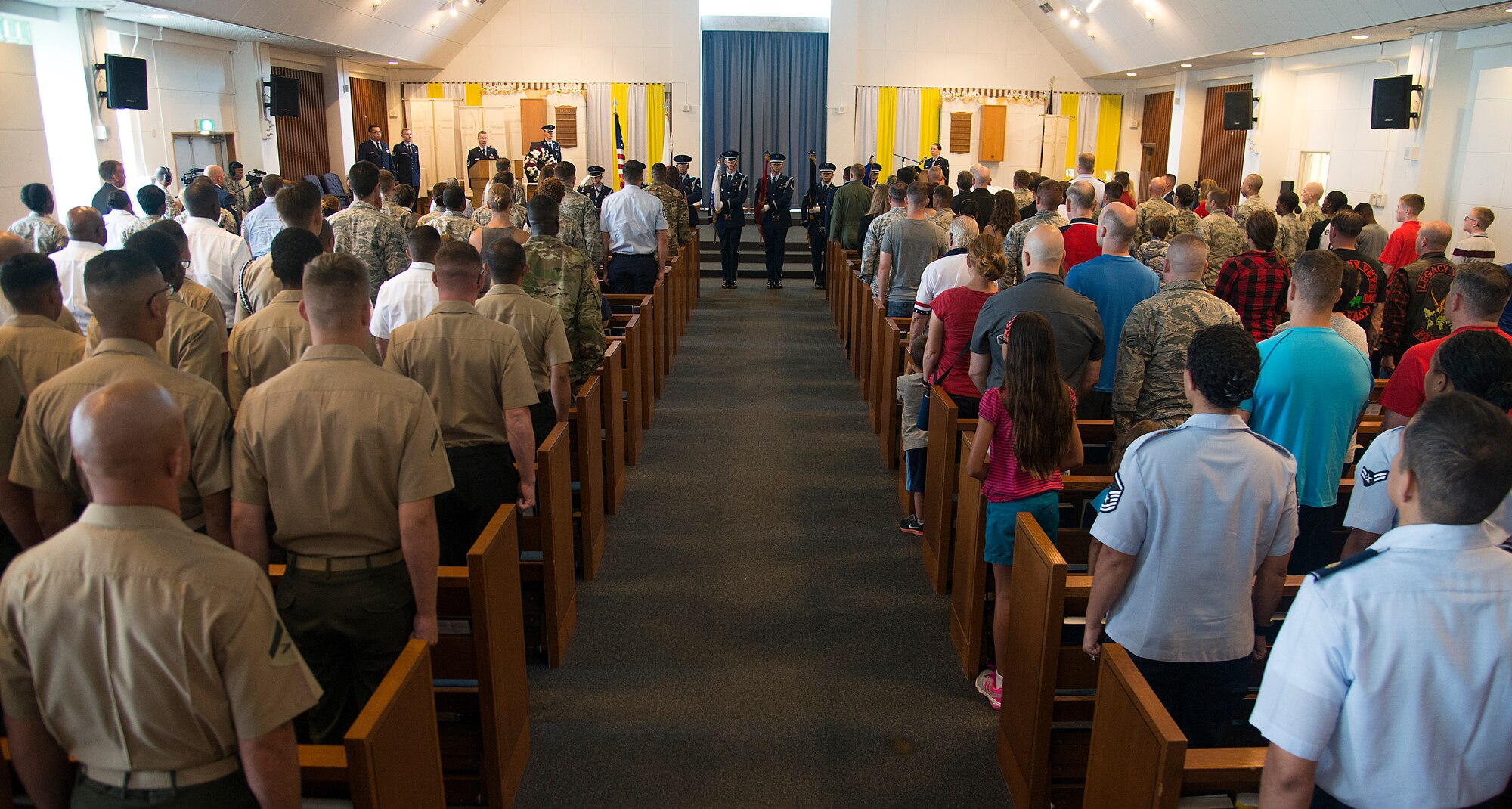 U.S. Air Force Kadena Air Base honor guardsmen present the flags to a multi-service audience during the Memorial Day ceremony at Chapel 1 May 30, 2016, at Kadena Air Base, Japan. Each year Memorial Day is held on the last Monday of May to honor service members who have fallen as a result of battle. (U.S. Air Force photo by Staff Sgt. Maeson L. Elleman) 