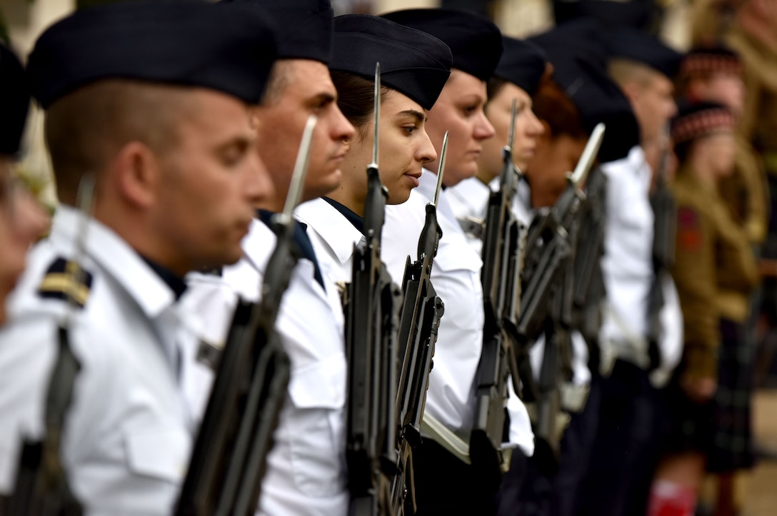 A formation of French airmen form an honor guard during a Memorial Day ceremony at the Suresnes American Cemetery, May 29, 2016. The cemetery is the final resting place for 1,565 Americans who fought and died in France during WWI and WWII.  More than 200 civilians, military members and official delegates from Poland, Vietnam, Japan, Germany, France and the United States attended the event. (U.S. Air Force photo by Senior Master Sgt. Brian Bahret/Released)