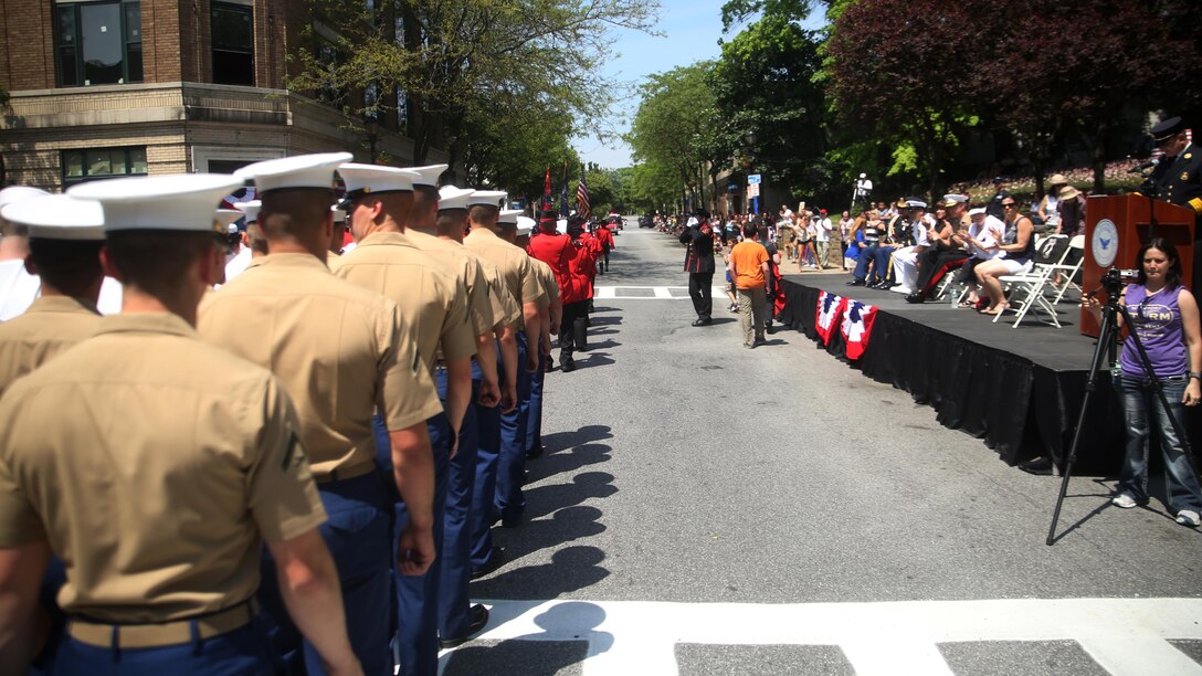 Marines and sailors march down a street in the Village of Hastings-on-Hudson, New York during a parade meant to honor fallen veterans, May 29, 2016. This year is the 28th year New York has hosted Fleet Week. U.S. Marines and sailors are in New York to interact with the public, demonstrate capabilities and teach the people of New York about America’s sea service.