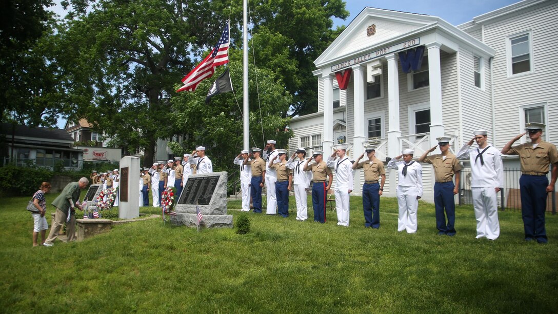 Marines and sailors salute a memorial in front of the Veterans of Foreign Wars detachment in the Village of Hastings-on-Hudson, following a wreath-laying ceremony meant to honor fallen veterans, May 29, 2016. This year is the 28th year New York has hosted Fleet Week. U.S. Marines and sailors are in New York to interact with the public, demonstrate capabilities and teach the people of New York about America’s sea service.