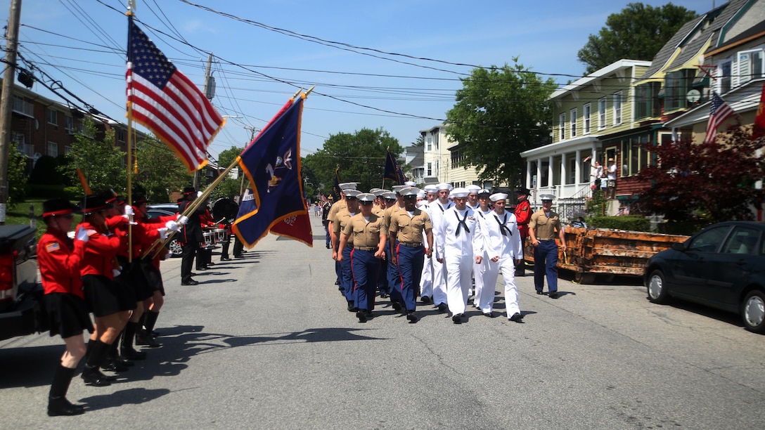 Marines and sailors march down a street in the Village of Hastings-on-Hudson, New York, during a parade meant to honor fallen veterans, May 29, 2016. This year is the 28th year New York has hosted Fleet Week. U.S. Marines and sailors are in New York to interact with the public, demonstrate capabilities and teach the people of New York about America’s sea service.