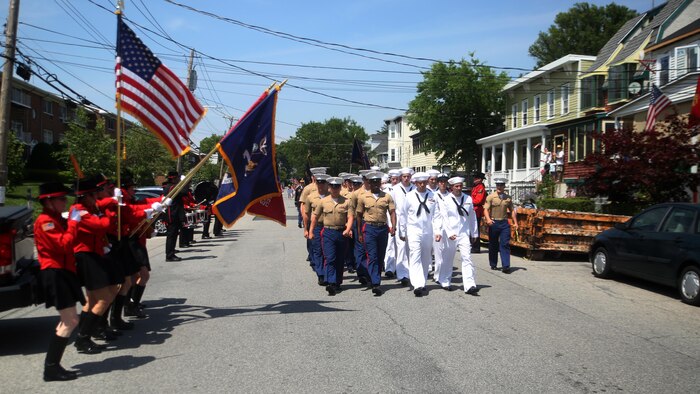 Marines and sailors march down a street in the Village of Hastings-on-Hudson, New York, during a parade meant to honor fallen veterans, May 29, 2016. This year is the 28th year New York has hosted Fleet Week. U.S. Marines and sailors are in New York to interact with the public, demonstrate capabilities and teach the people of New York about America’s sea service.