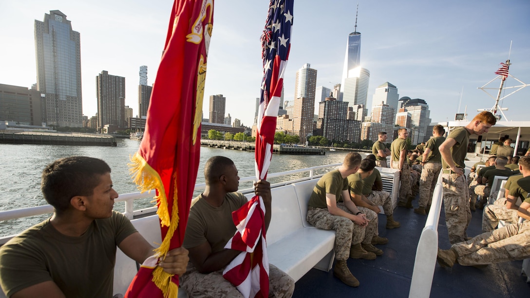 U.S. Marine Cpl. Juan Hernandez, left, armorer, and Cpl. Xavier Lewis, supply administration and operations specialist, both with the 24th Marine Expeditionary Unit, take a water taxi to the start point of the Freedom Run as part of Fleet Week in New York, May 29, 2016. Service members from U.S. Marine Corps, U.S. Navy and Candadian Navy ran from the North Cove Marina to the 9/11 Memorial to honor the fallen. 