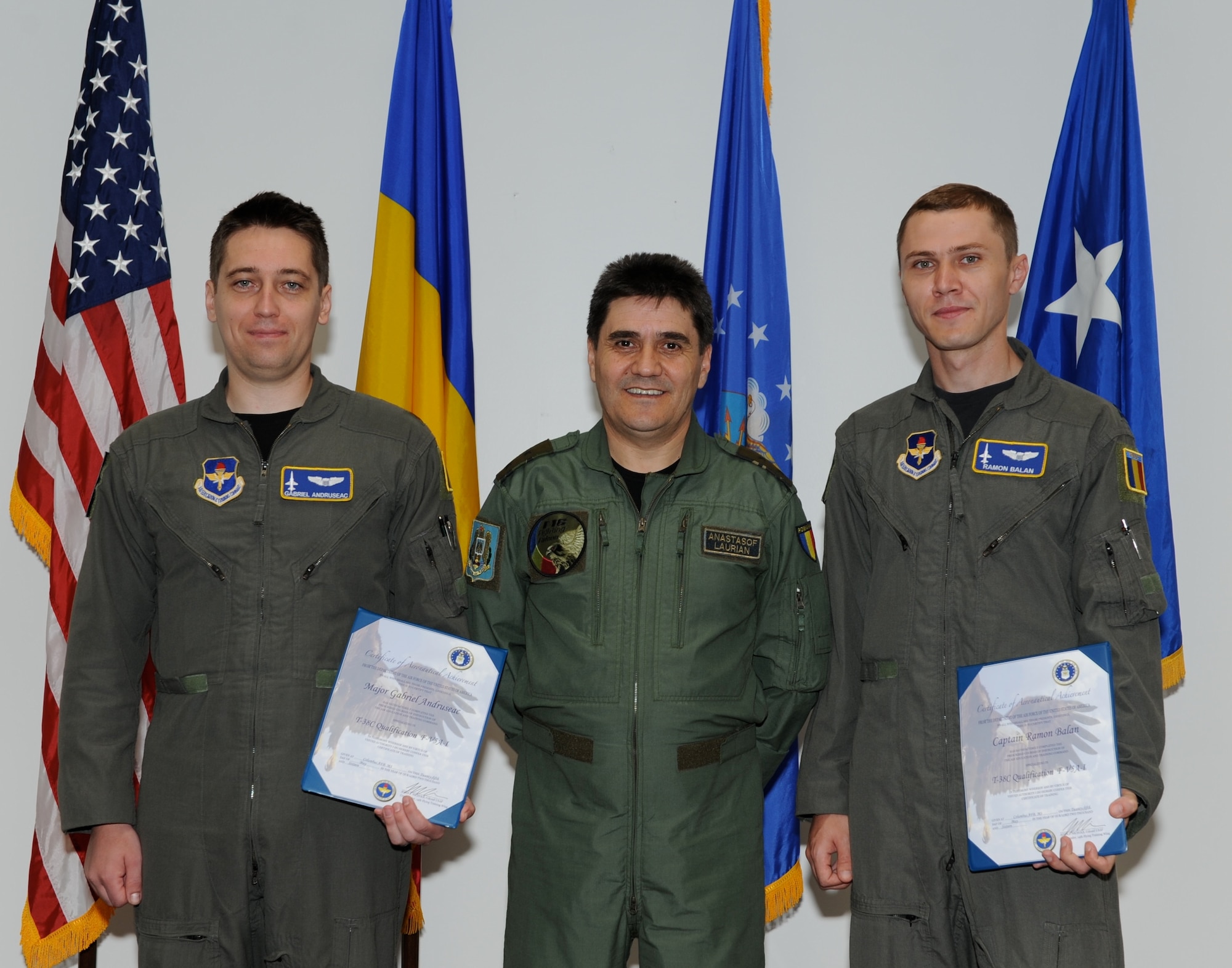 Maj. Gen. Laurian Anastasof, Chief of the Air Staff Romanian air force, stands with Maj. Gabriel Andruseac and Capt. Ramon Balan, Romanian Pilots, after a Course Completion Ceremony in Faulkner Auditorium during his visit May 25 at Columbus Air Force Base, Mississippi. The Romanian MiG-21 pilots completed the T-38C training course to prepare them for Introduction to Fighter Fundamentals. IFF is the next flying training course they will be taking as the Romanian AF prepares to begin flying the F-16 Falcon. (U.S. Air Force photo/Elizabeth Owens)