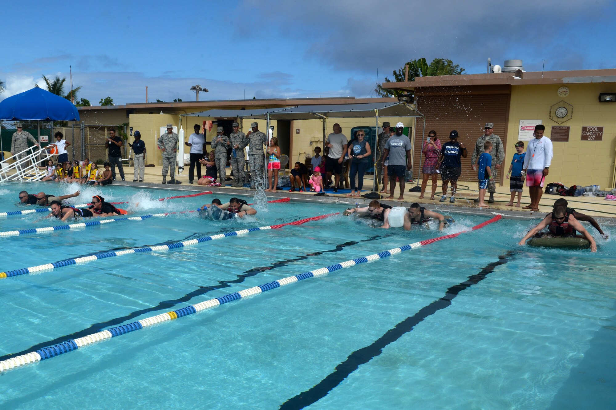 Participants of the Boat Blitz race homemade boats May 25, 2016, at Andersen Air Force Base, Guam. The Boat Blitz is a competition that challenges participants to create boats made entirely of plastic bottles and duct tape. (U.S. Air Force photo by Airman 1st Class Alexa Ann Henderson)