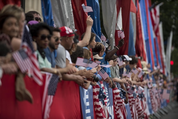 A crowd of supporters and observers wave American flags and cheer on parade participants along Constitution Avenue during the 2016 National Memorial Day Parade in Washington, D.C., May 30. Approximately a hundred U.S. Army Reserve Soldiers marched in this year's parade, represented by the 200th Military Police Command, from Fort Meade, Maryland; the 55th Sustainment Brigade, from Fort Belvoir, Virginia; and the Military Intelligence Readiness Command, from Fort Belvoir. (U.S. Army photo by Master Sgt. Michel Sauret)