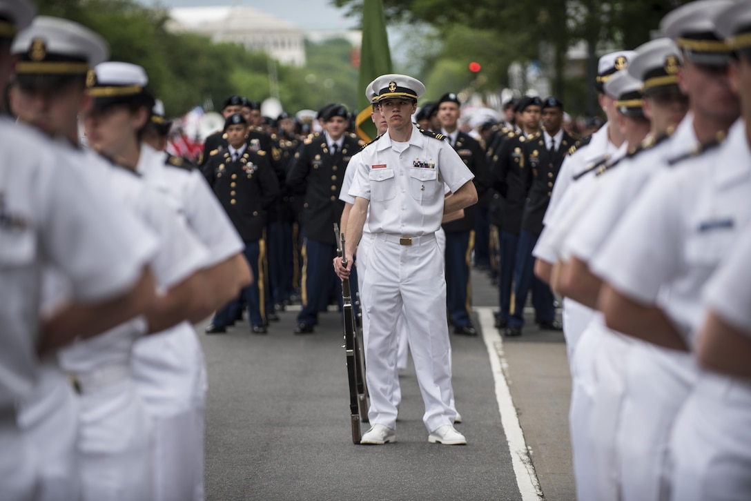 Members of the Regimental Band and Honor Guard, Massachusetts Maritime Academy, stand in formation on Constitution Avenue during the 2016 National Memorial Day Parade in Washington, D.C., May 30. (U.S. Army photo by Master Sgt. Michel Sauret)